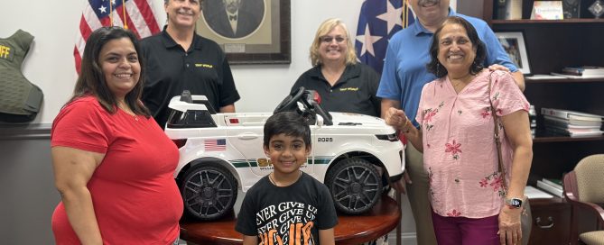 Back L-R: Craig and Anna Nangle, Owners of Tint World Murfreesboro, Sheriff Jeff Hughes and the Naik family.