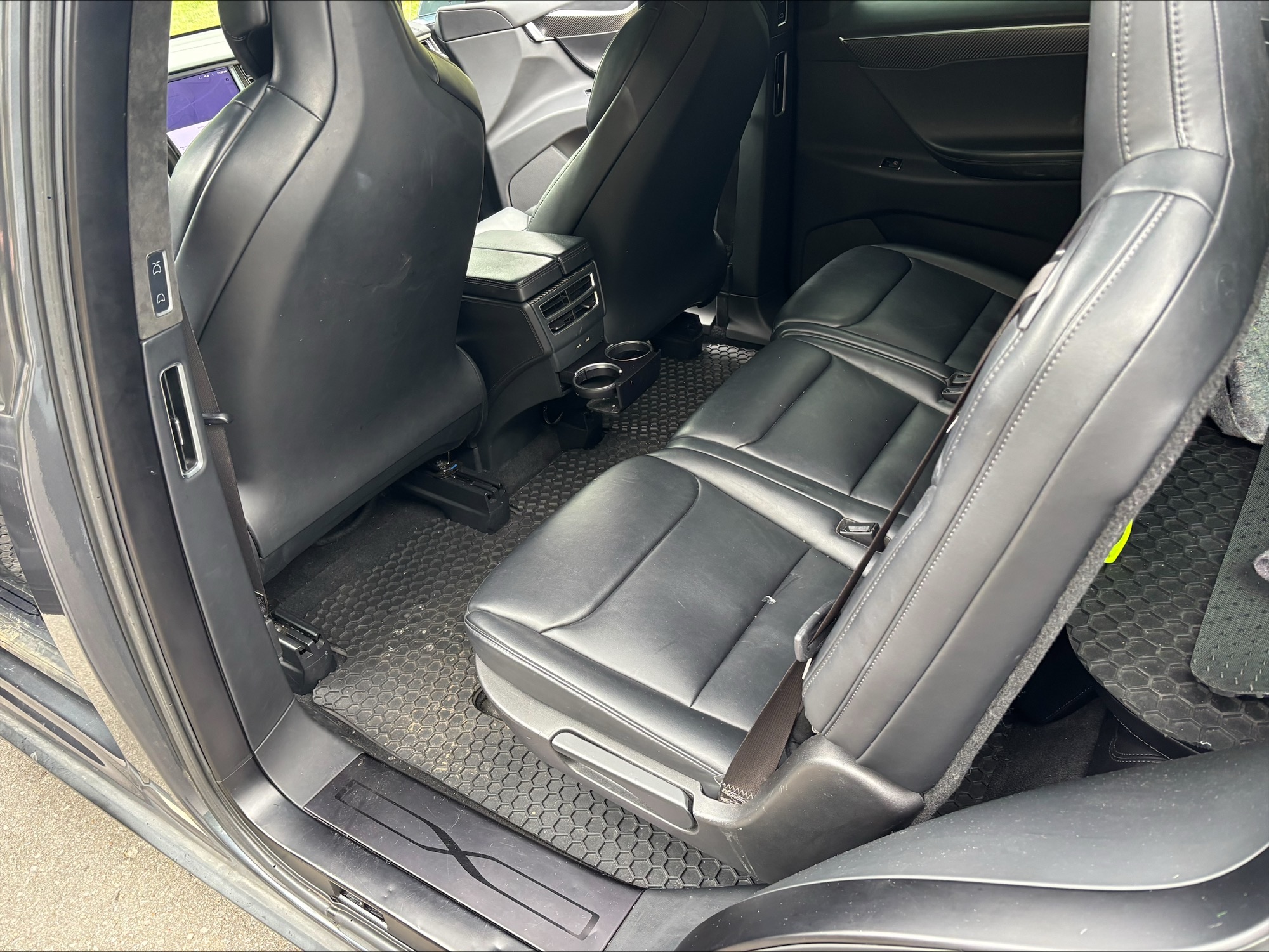 Gray, leather-like interior sears of a Tesla Model X. interior