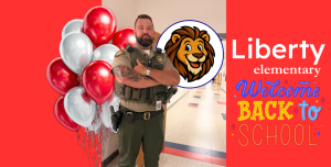 WCSO SRO Deputy Anglin stands with his arms crossed in a hallway at Liberty Elementary School. The graphic features red and silver balloons, the Liberty Elementary lion mascot, and colorful “Welcome Back to School” artwork on a bright red background.