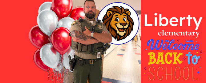 WCSO SRO Deputy Anglin stands with his arms crossed in a hallway at Liberty Elementary School. The graphic features red and silver balloons, the Liberty Elementary lion mascot, and colorful “Welcome Back to School” artwork on a bright red background.