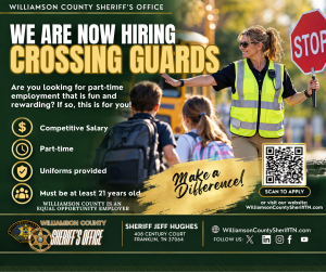 Williamson County Sheriff’s Office recruitment graphic announcing, “We Are Now Hiring Crossing Guards.” A school crossing guard wearing a reflective safety vest holds a stop sign while helping two children cross near a school bus. The graphic highlights competitive salary, part-time work, uniforms provided, and a minimum age of 21. It includes the message “Make a Difference,” a QR code to apply, WilliamsonCountySheriffTN.com, WCSO branding, Sheriff Jeff Hughes’ name and office contact information.