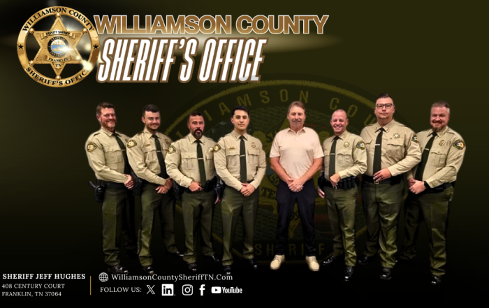 Seven uniformed deputies stand alongside a man in a tan polo shirt. The graphic features a gold badge, the heading “Williamson County Sheriff’s Office” and a faint Office emblem on a dark olive and black background. The footer reads “Sheriff Jeff Hughes” and includes 408 Century Court, Franklin, TN 37064; WilliamsonCountySheriffTN.com; and social media icons.