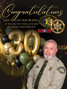 ALT Text: Congratulations graphic honoring Williamson County Sheriff's Office Lt. Joe Burns for 30 years of dedicated service. The design features a portrait of Lt. Burns in uniform, large metallic gold “30” balloons surrounded by olive green, black and gold balloons, and WCSO insignia. Gold lettering reads, “Congratulations Lieutenant Joe Burns & Thank You for 30 Years of Dedicated Service.” Gold confetti accents the black background.